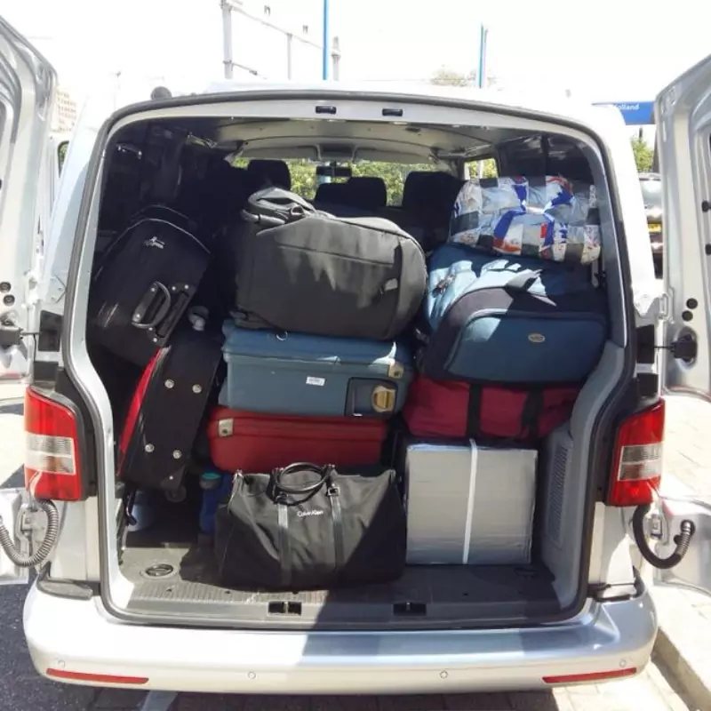 Large cab bus from Regio Taxi Spijkenisse at airport for early flight"